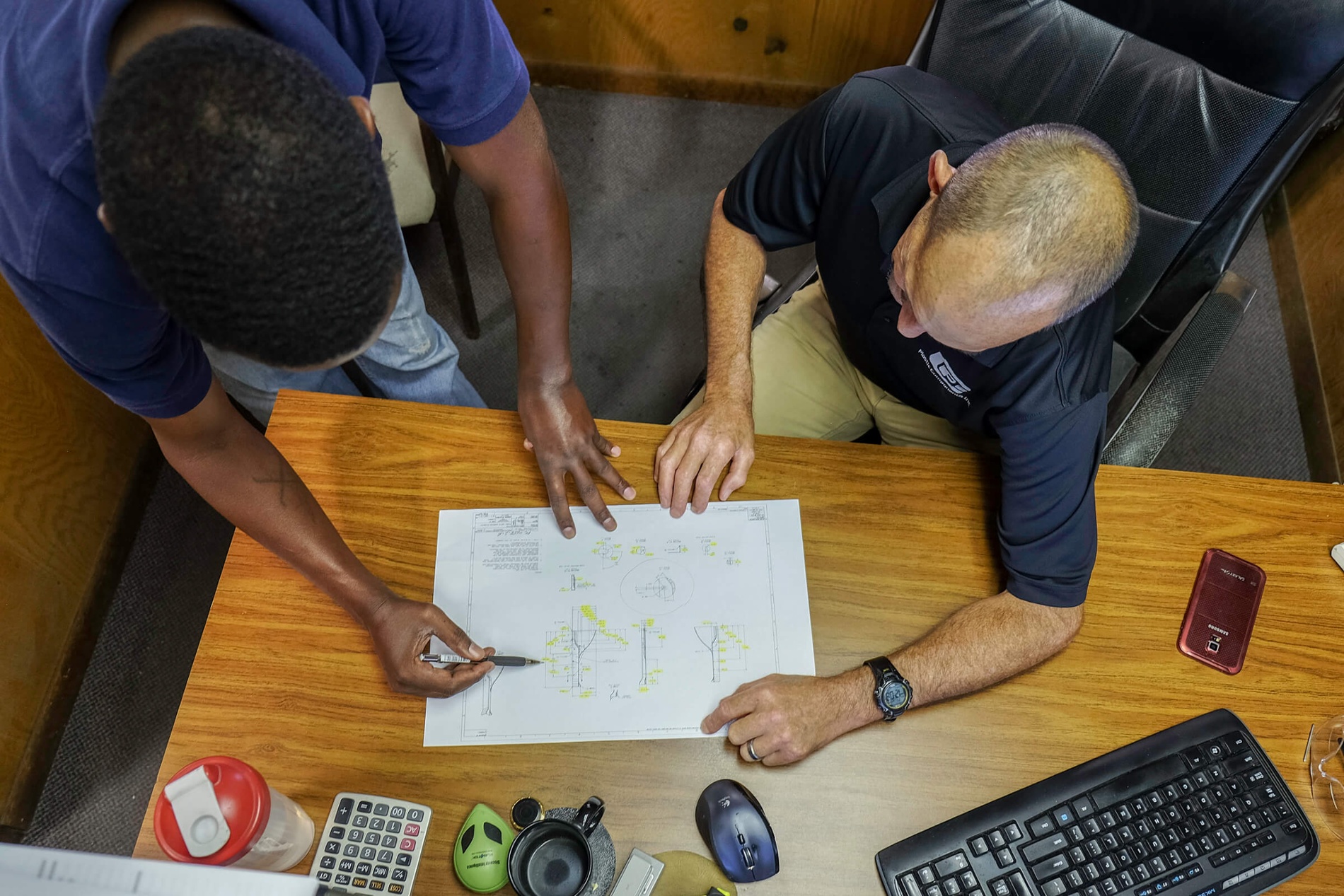Engineering Team Reviewing Prints